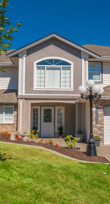 main-entrance-luxury-house-with-flowerbed-grass-lawn-front (1)